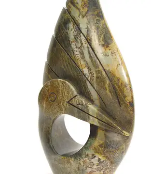 Stone bird figure with wings up