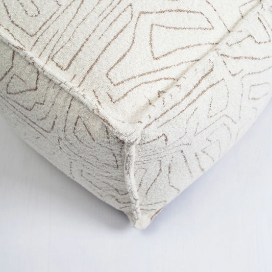 Ottoman pouf, fabric, minimalist print, white and beige color